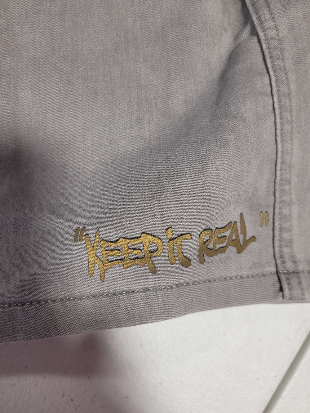 next White and Light Gray Kids' Garment Tag Close-Up - Picture 4 of 5